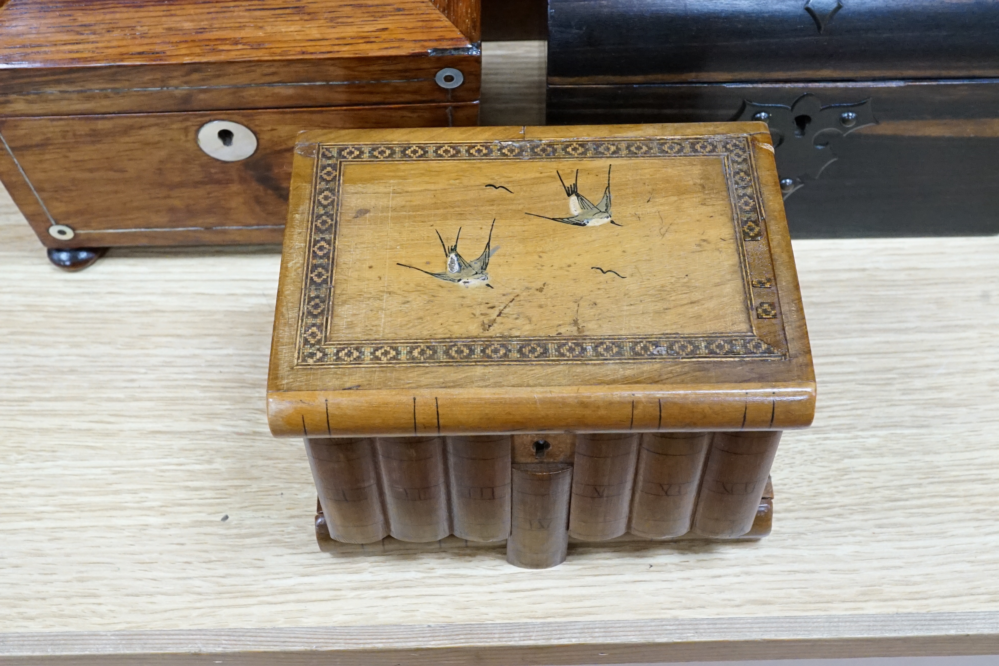 A Victorian coromandel stationary box, a rosewood tea caddy, an olive wood jewellery casket, a mahogany box and a chinoiserie panel, largest 41cm wide